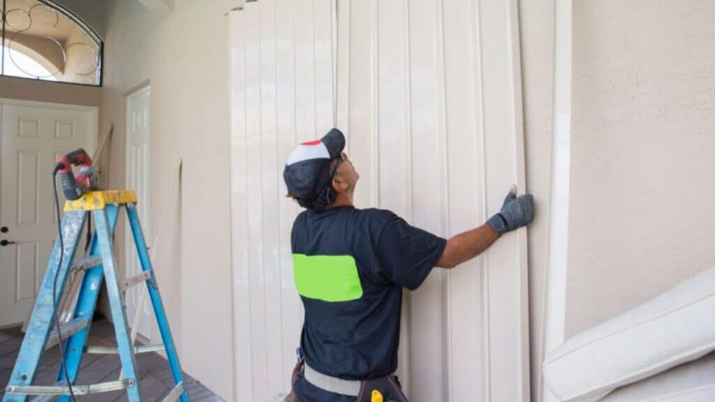 Storm shutters being installed on a Florida home